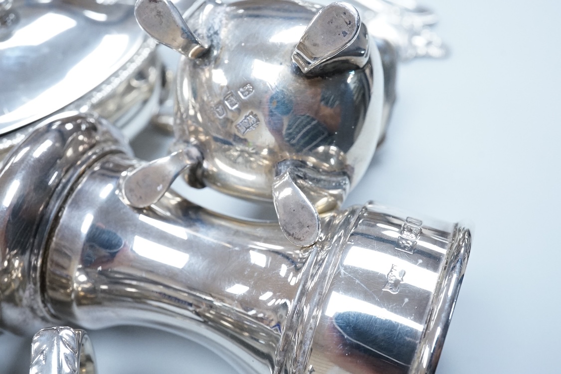 Two George VI silver three piece condiment sets by Walker & Hall, London, 1936/7, together with a modern silver mounted pepper mill by Mappin & Webb and two plated spoons.